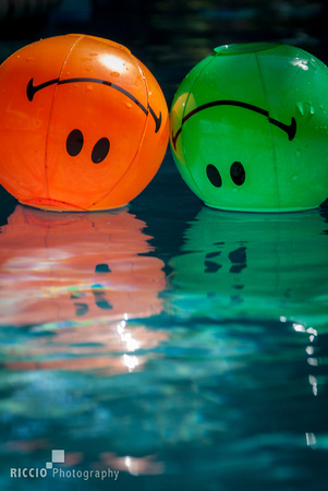 Inflatable balls in the pool, photographed by Maurizio Riccio