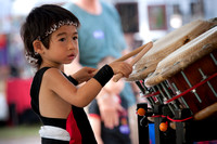 Young asian kid playing the drums