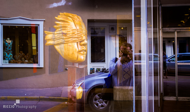 Reflection in a store window photographed by Maurizio Riccio