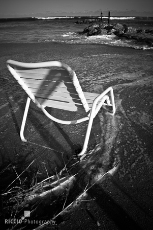 Beach chair at water's edge in Boca Raton. Photographed by Maurizio Riccio