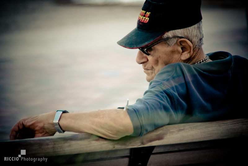 Old man checking his watch photographed by Maurizio Riccio