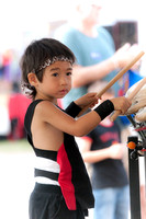 Young asian kid playing the drums